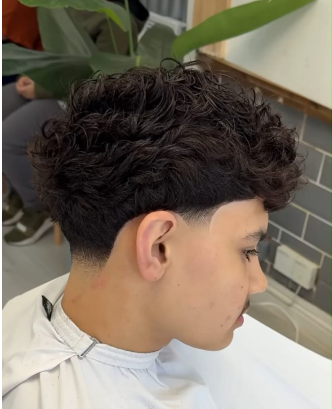 Low taper fade with curly Hair